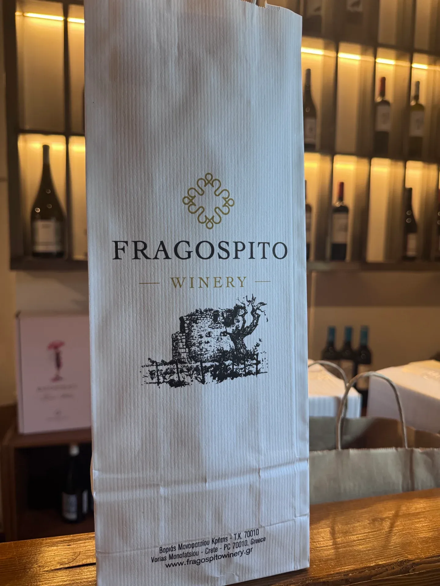 The Fragospito name and illustration on a white wine bag