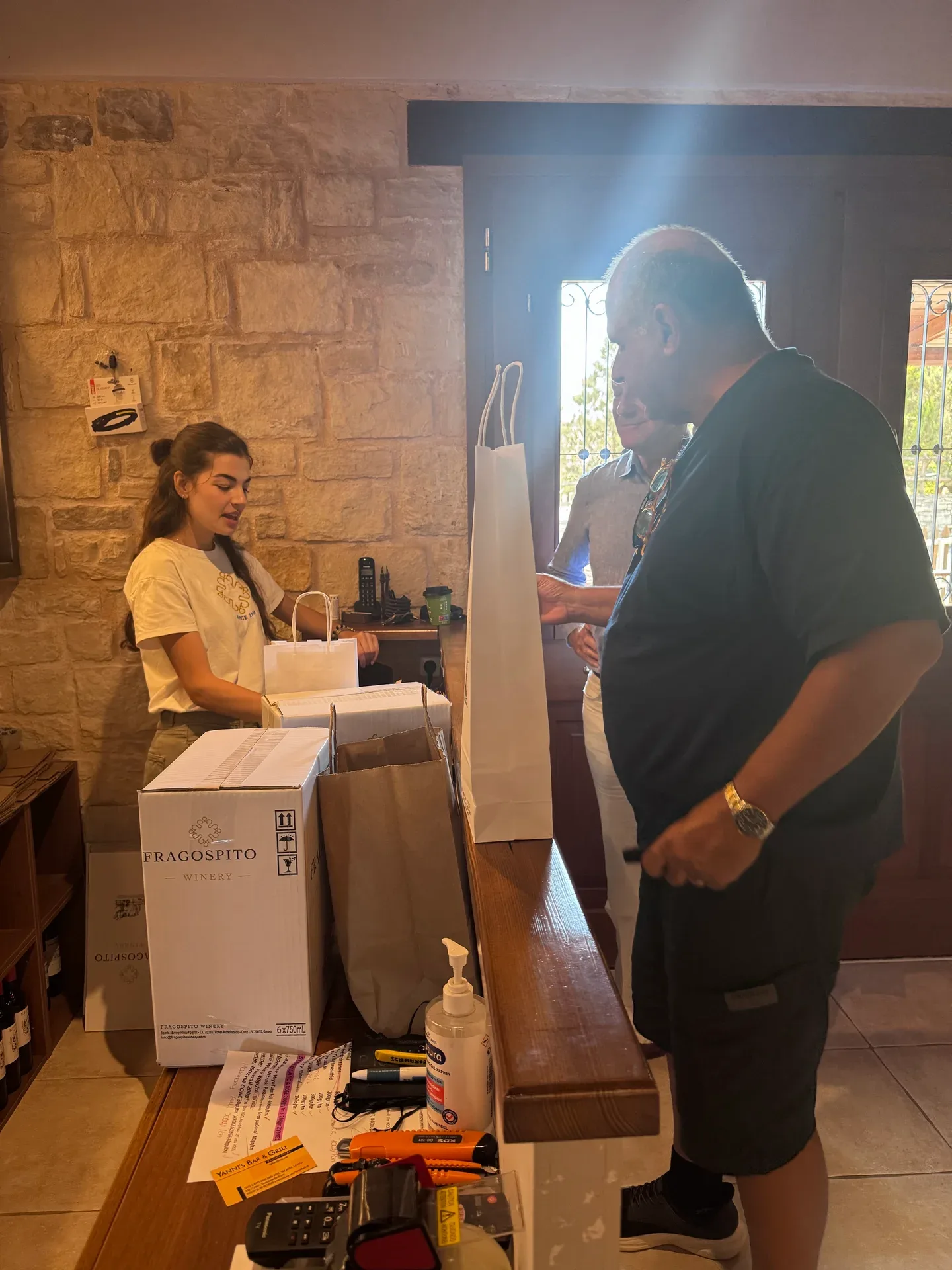 Wine being packed at the stone-walled winery counter