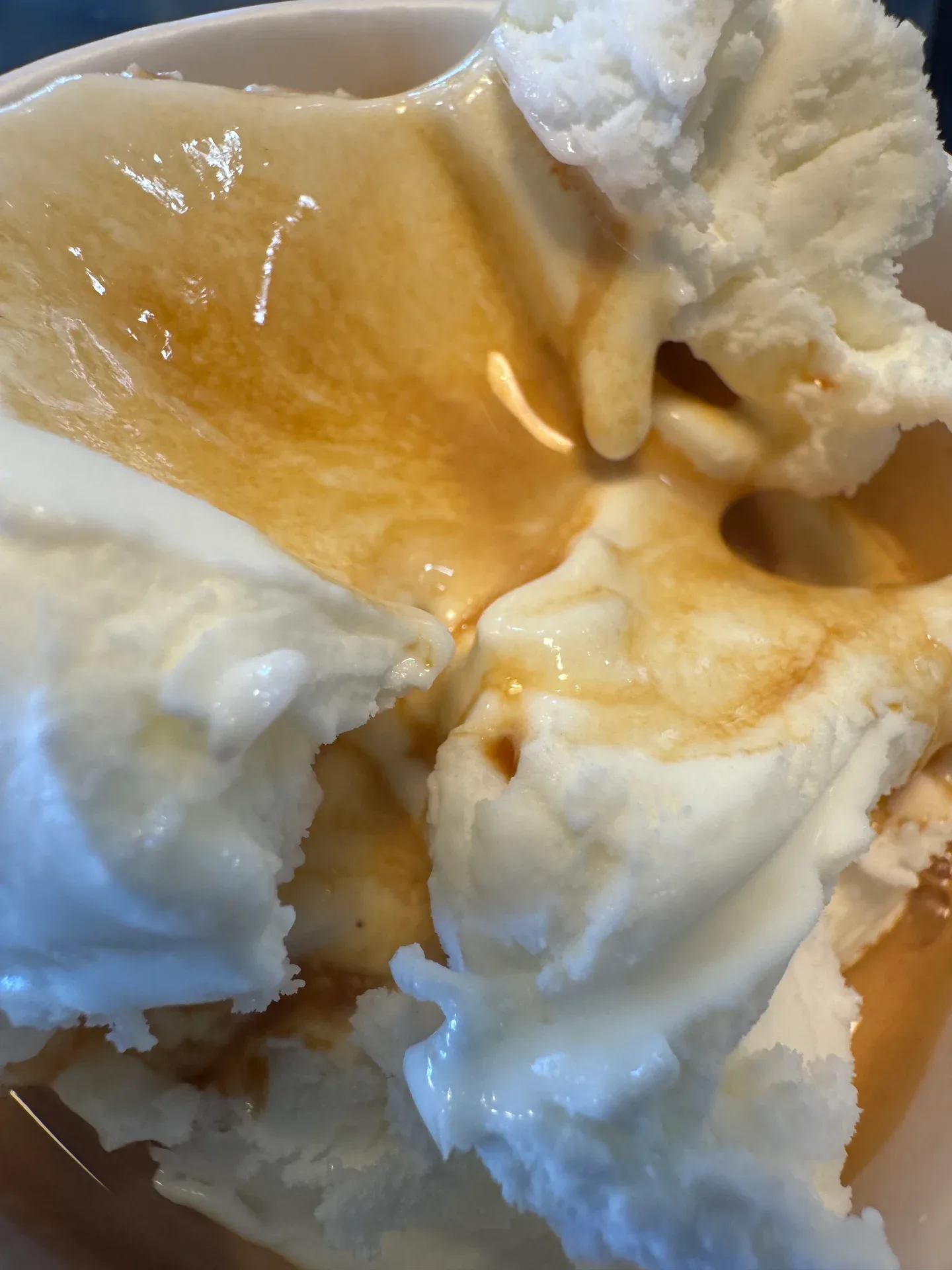 Close-up of an affogato made with scoops of ice cream and coffee