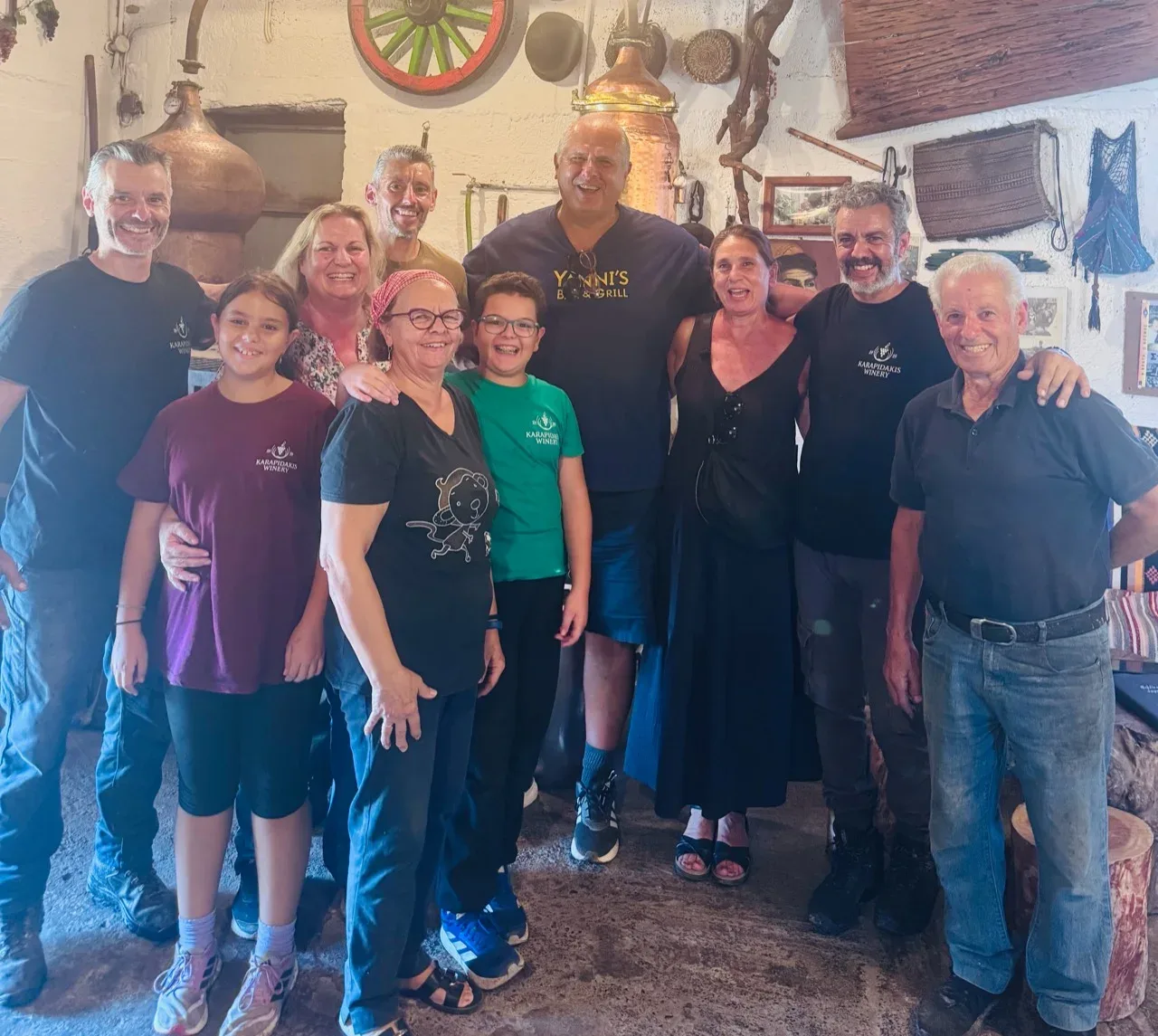 Yanni, Denise and the Karapidakis family gathered inside the winery