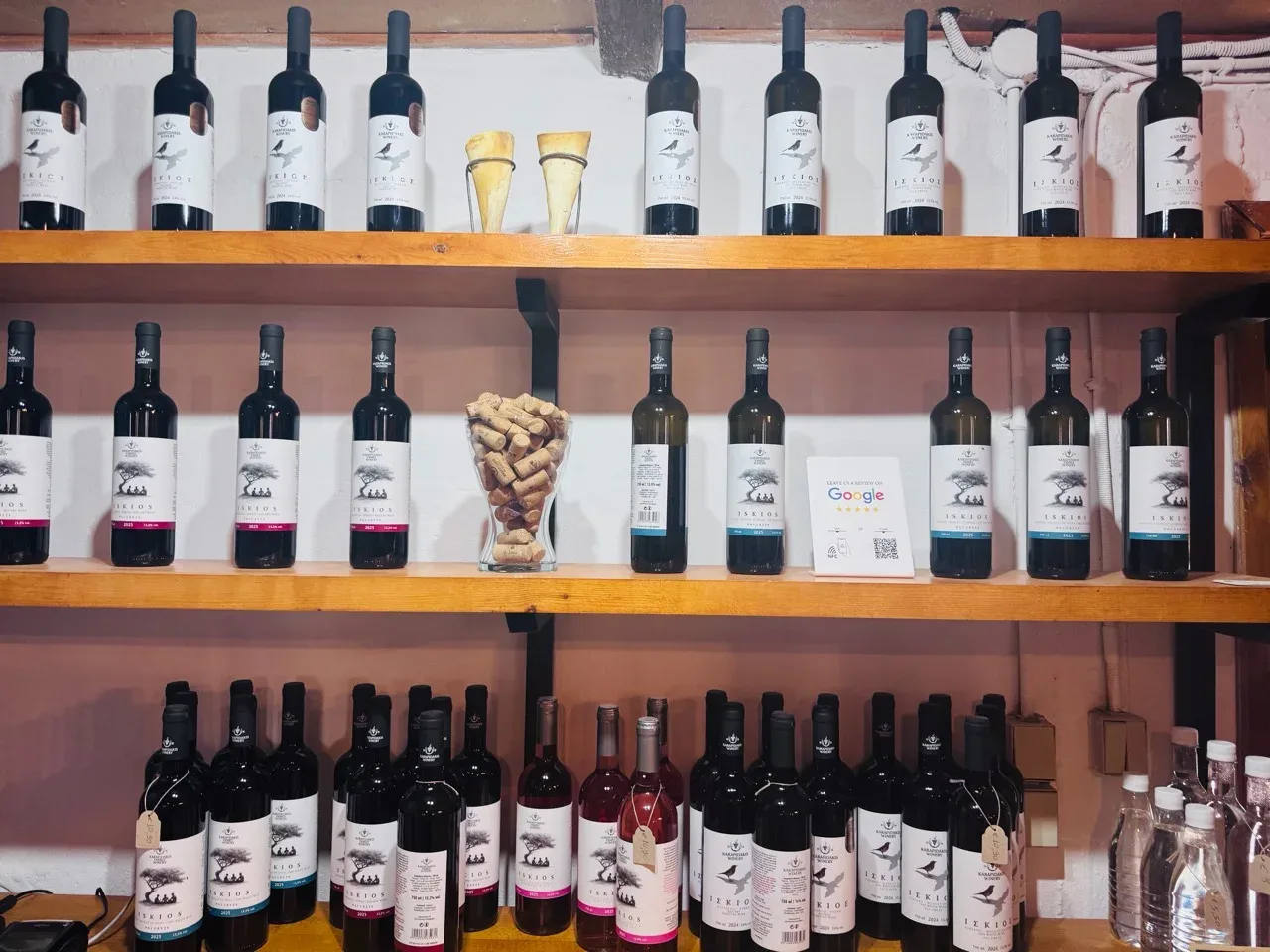 Shelves filled with Karapidakis ISKIOS wine bottles